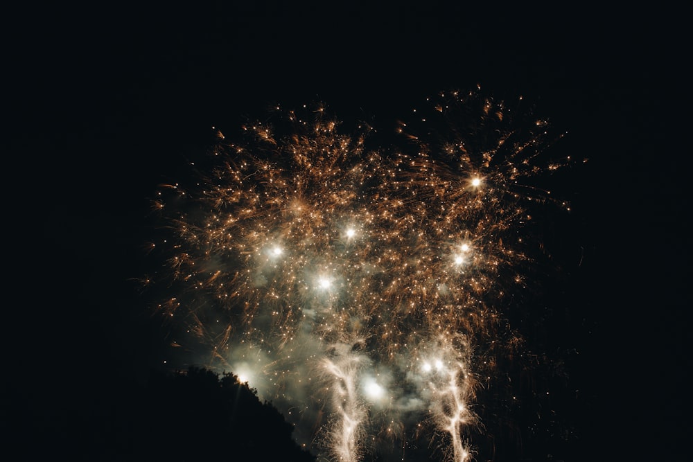 white and yellow fireworks during nighttime