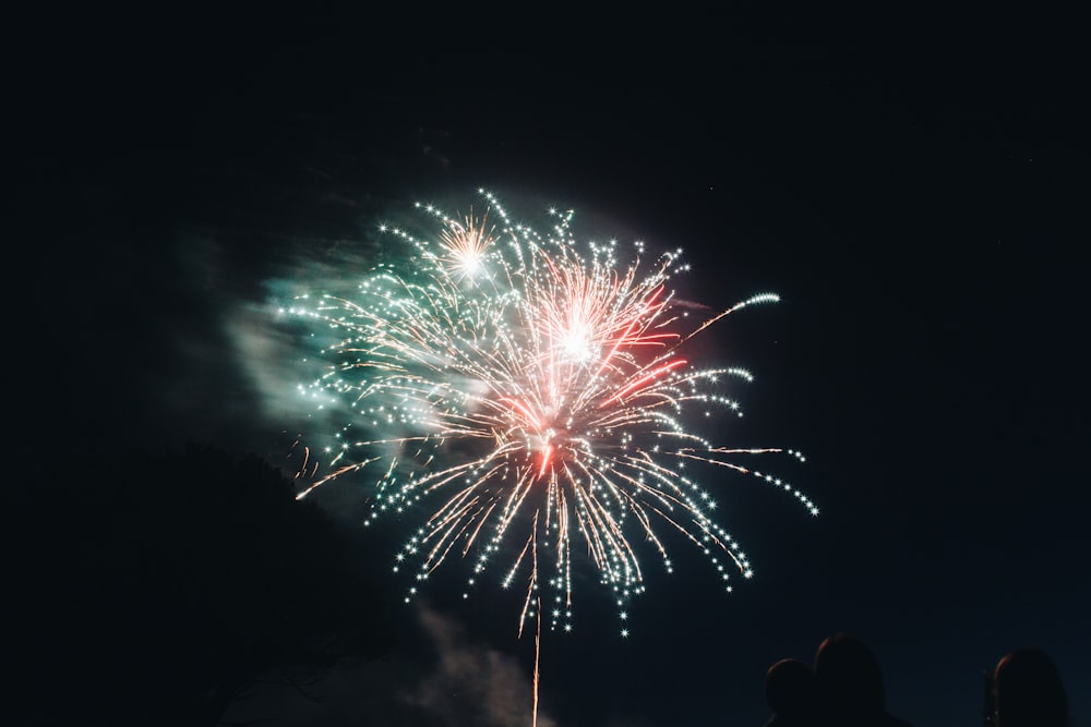 green and red fireworks during nighttime