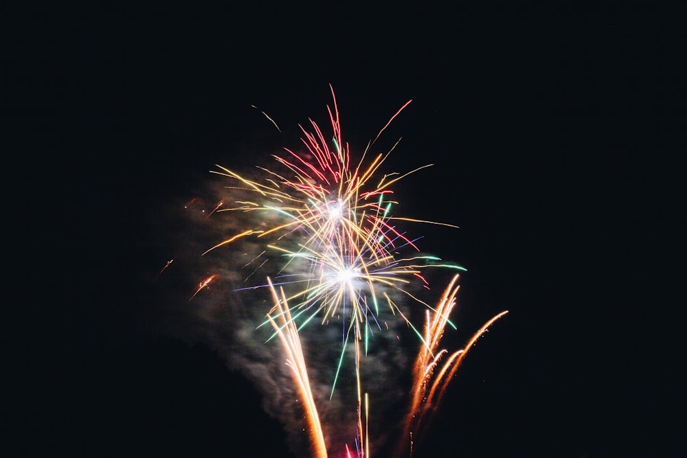 red and yellow fireworks during nighttime