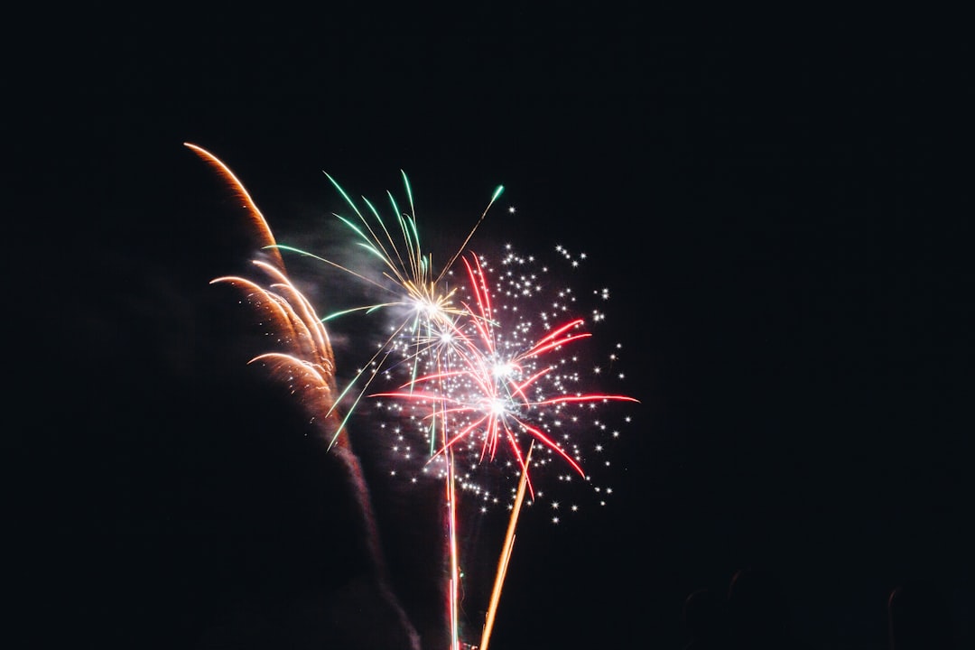 red and white fireworks display during nighttime