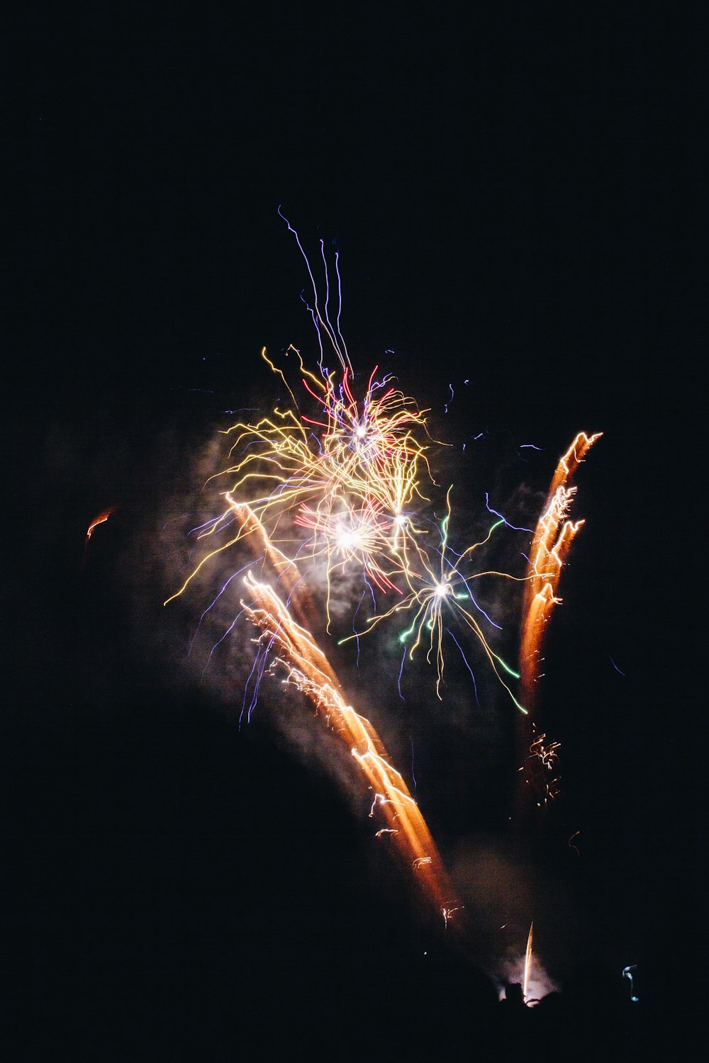 white and red fireworks during nighttime
