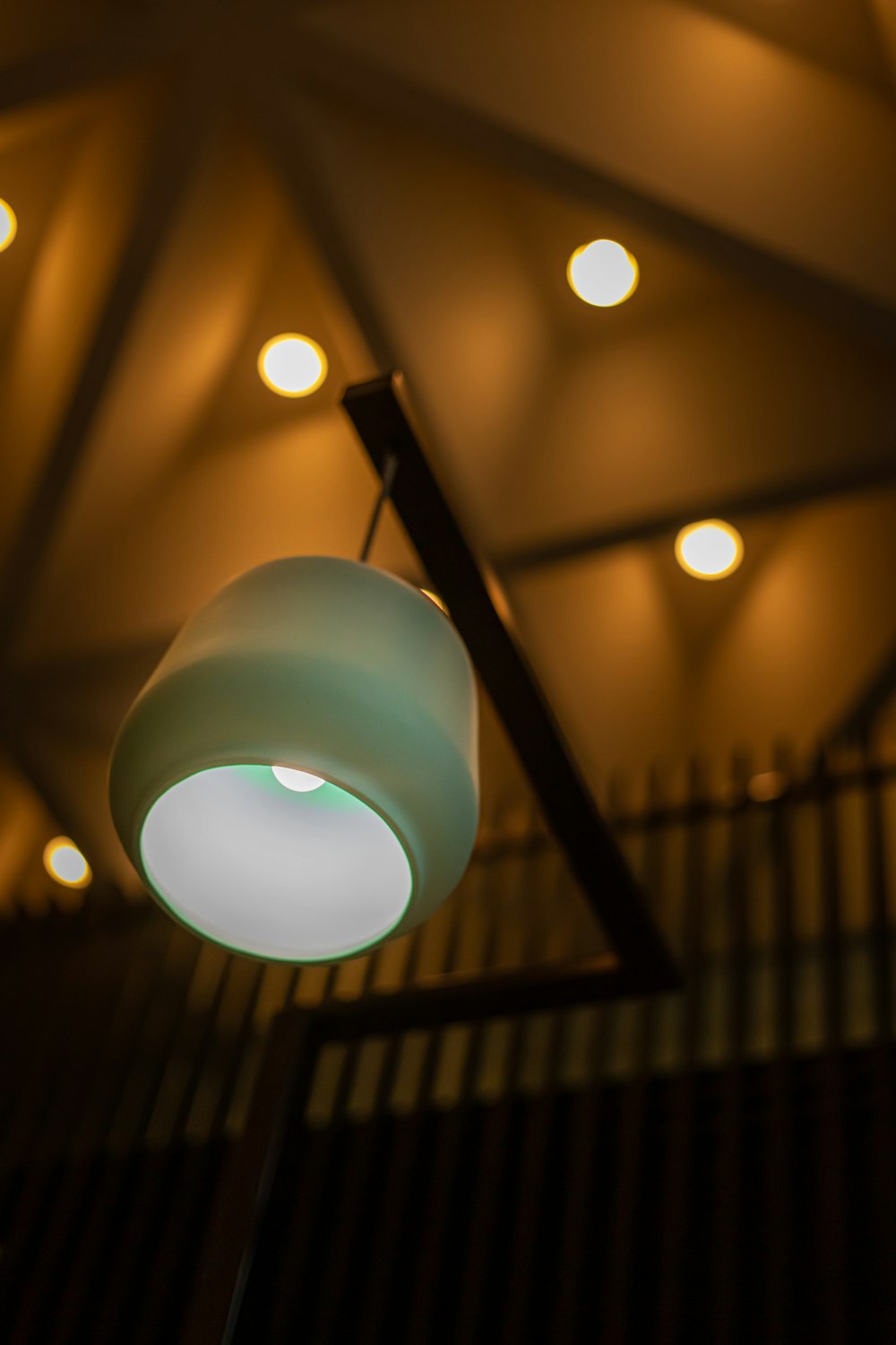 white pendant lamp turned on in room