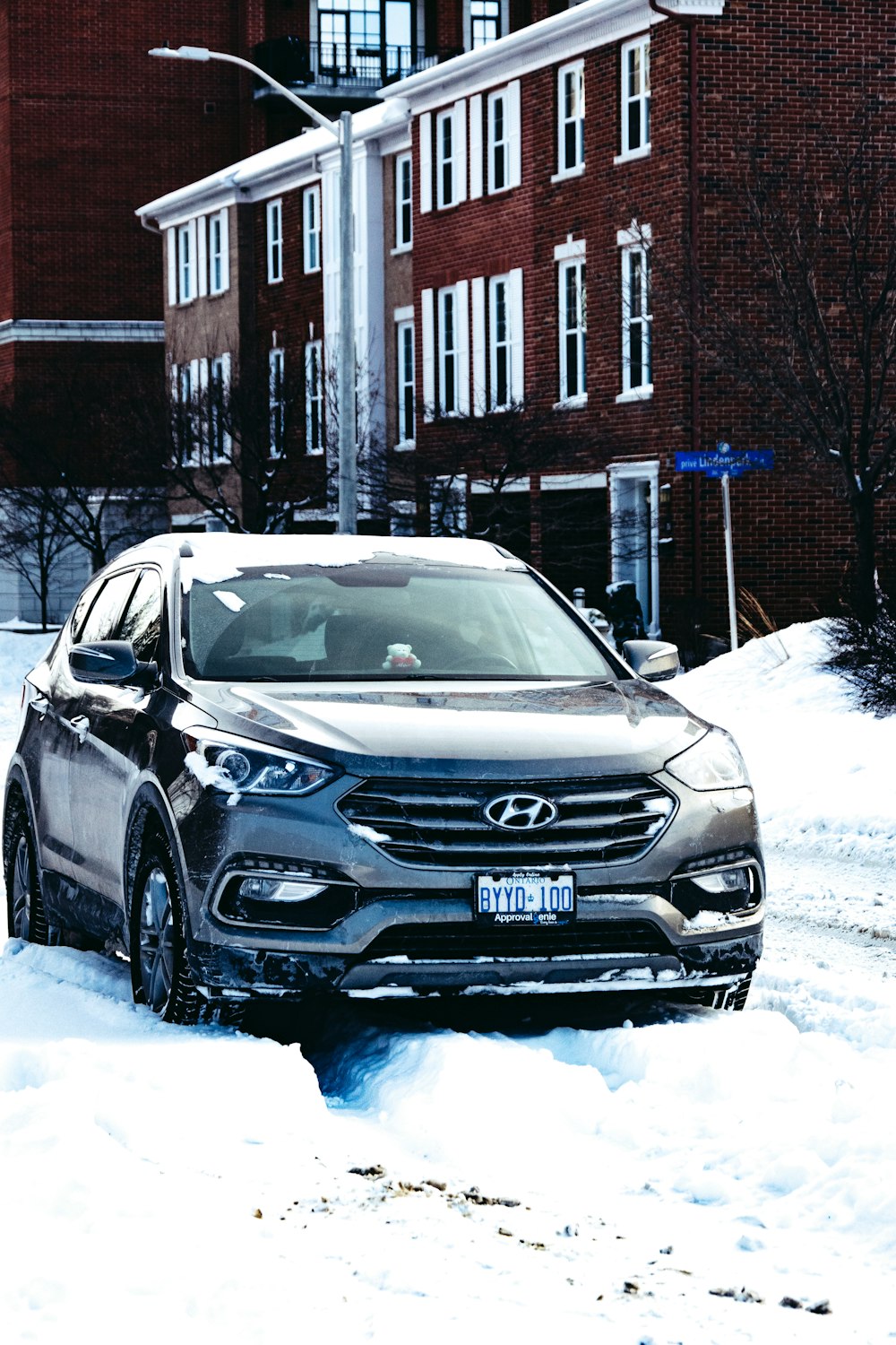 black honda car on snow covered road during daytime