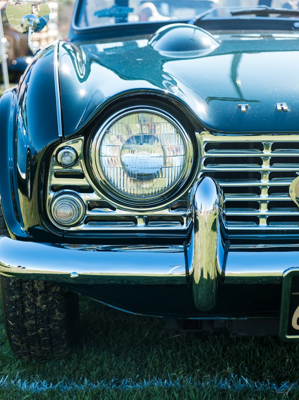 blue classic car in close up photography