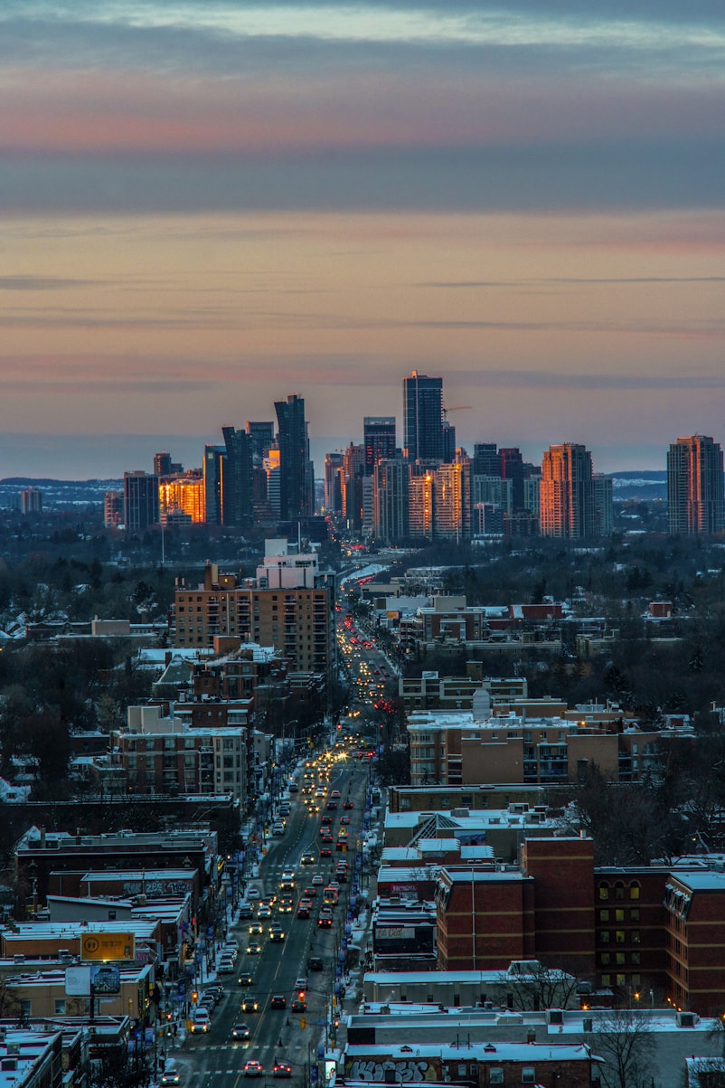city with high rise buildings during night time