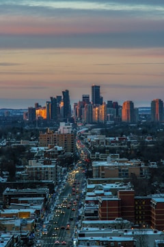 city with high rise buildings during night time