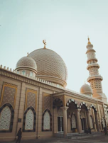 The serene view of Masjid Nabawi's green dome at dawn.