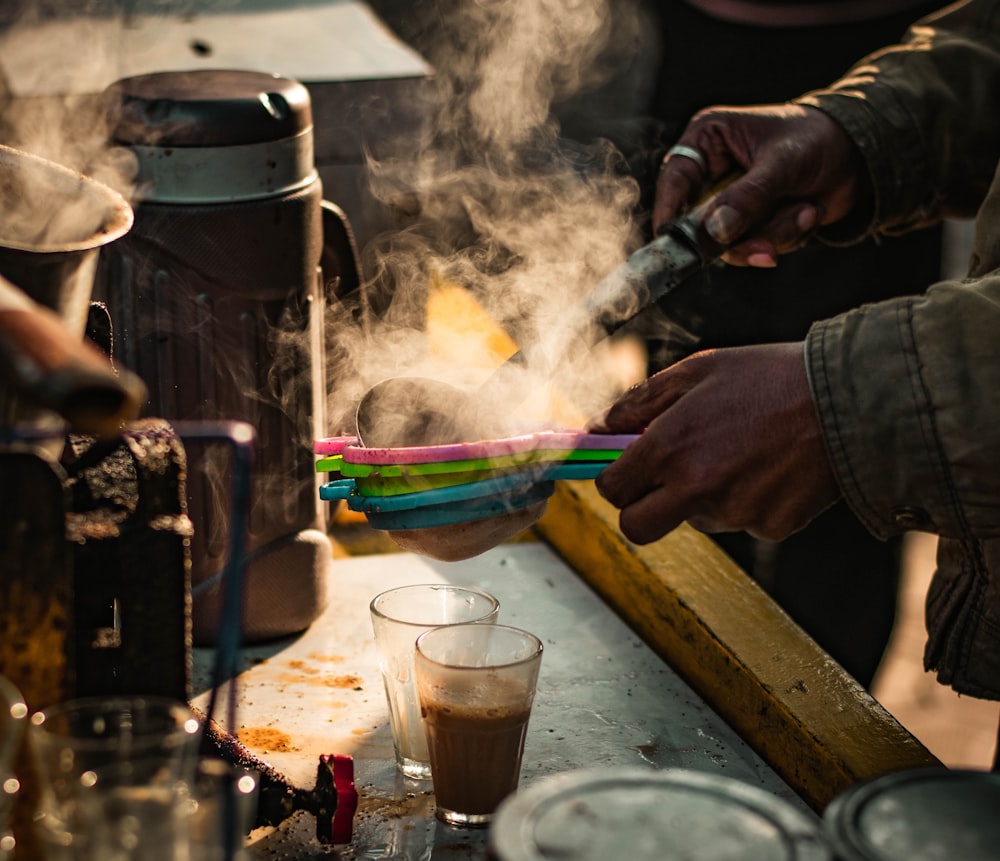 person holding a stick with powder