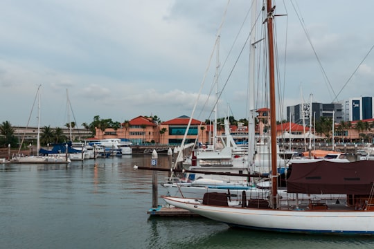 white boat on body of water during daytime in Tuas Link MRT Station Singapore