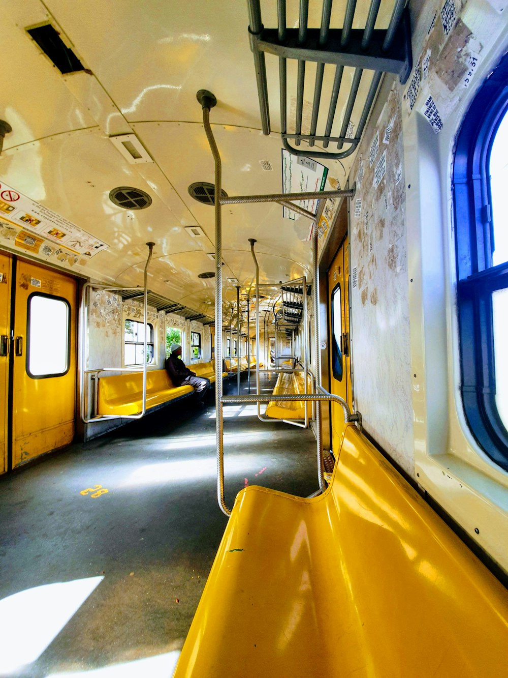 yellow and blue train in train station