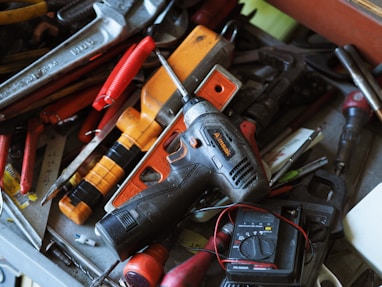 black and orange cordless power drill