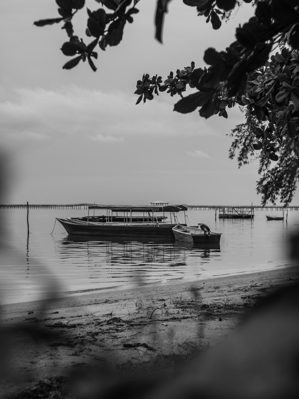 grayscale photo of boat on water