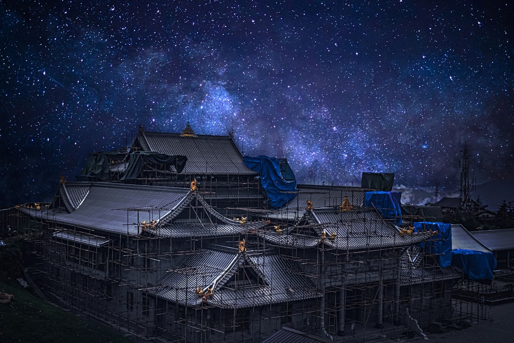 blue and white building under starry night