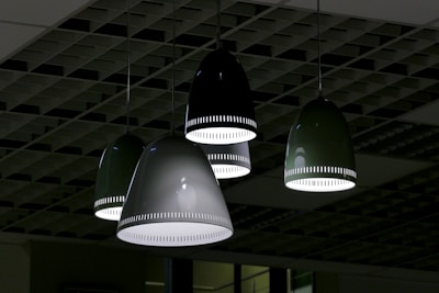 white pendant lamps turned on in room