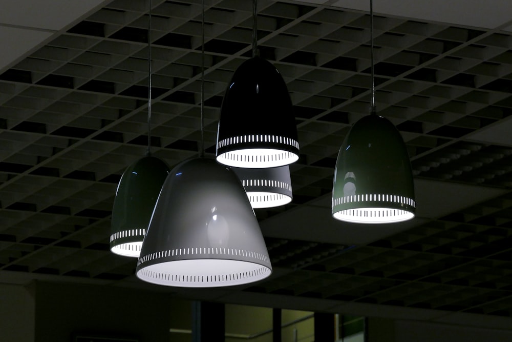 white pendant lamps turned on in room