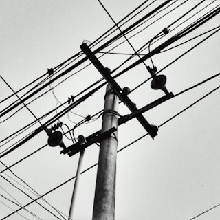 Close-up aerial image displaying intricate telecom cabling over challenging terrain.