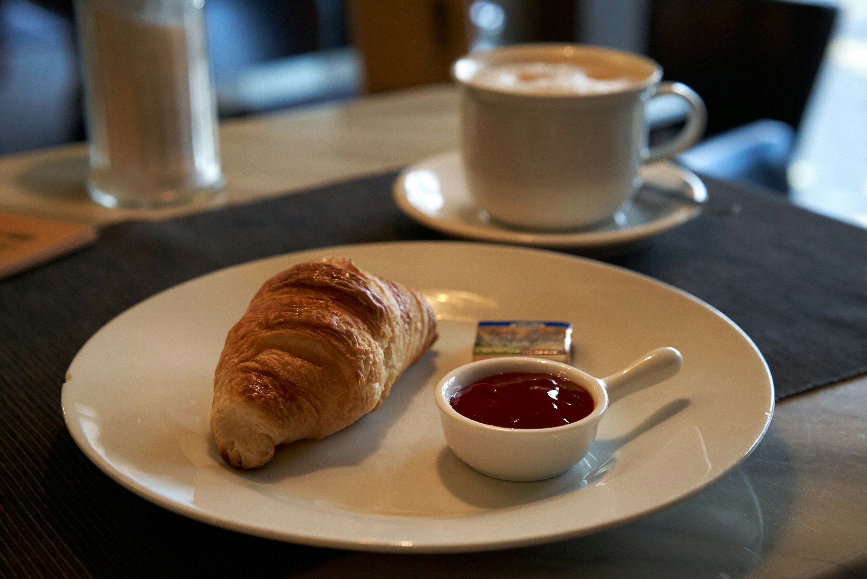 Simple Breakfast with Croissant and Cappuccino