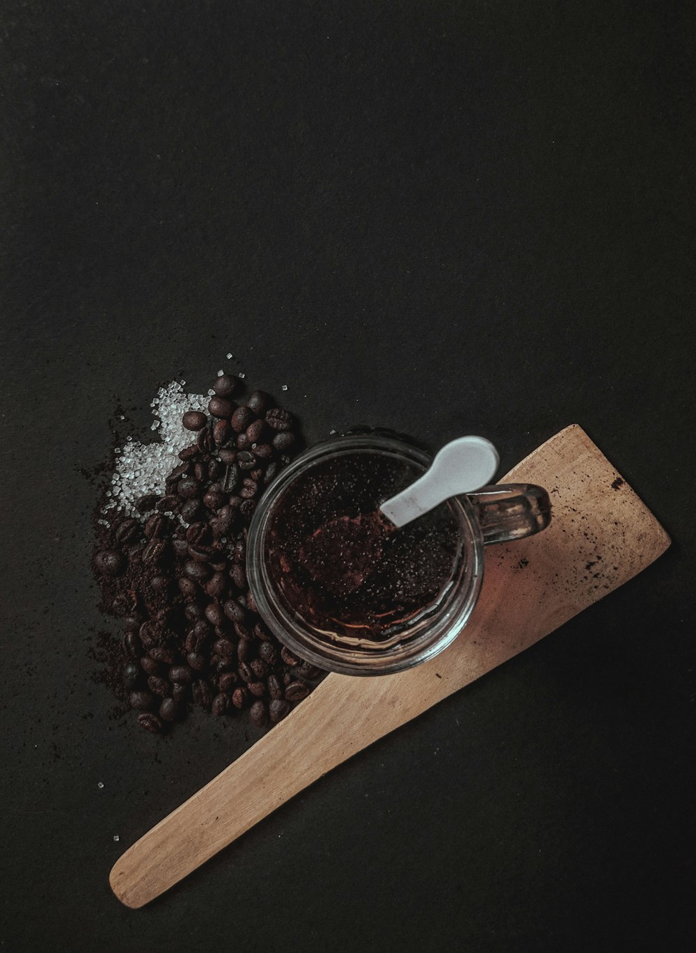 coffee beans on brown wooden chopping board