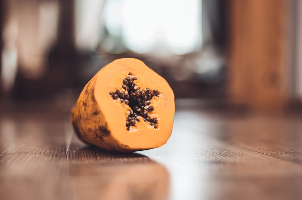 yellow and black round ornament on brown wooden table