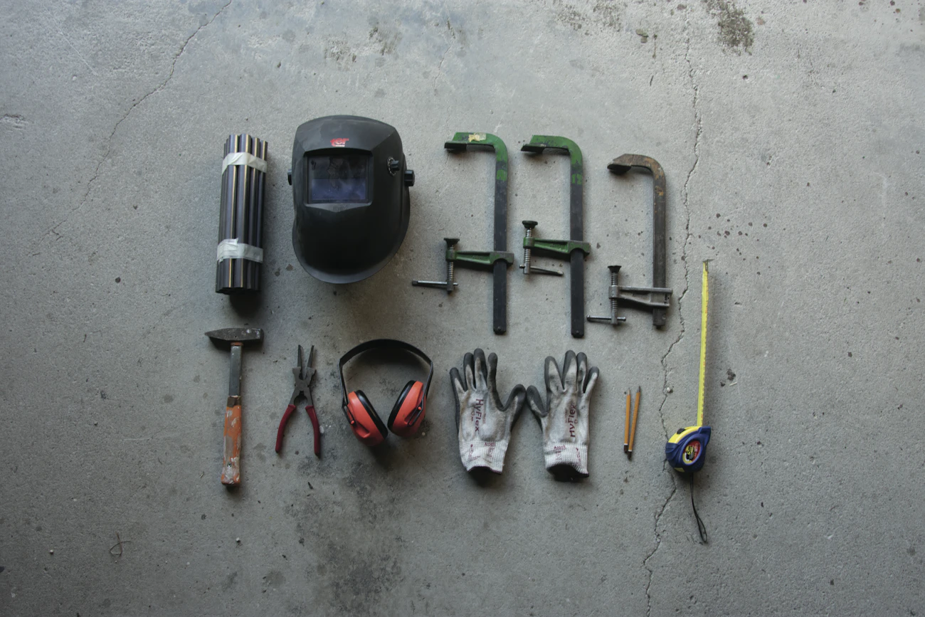 Maintenance tools arranged on a concrete floor