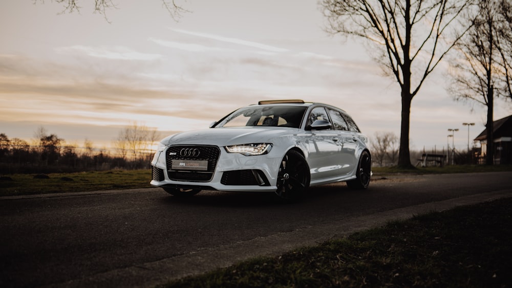 white bmw m 3 on road during daytime