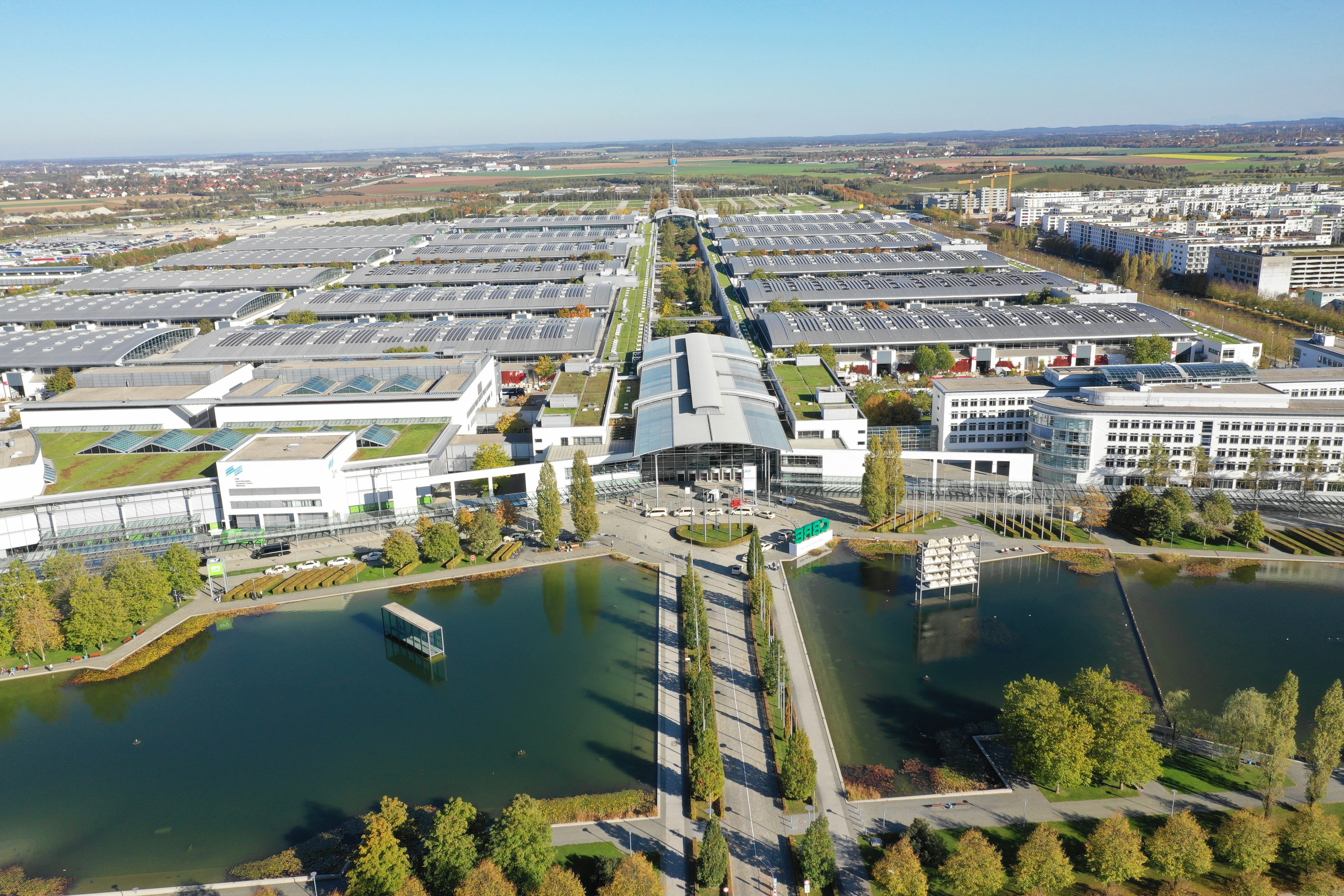 white and gray building near body of water during daytime