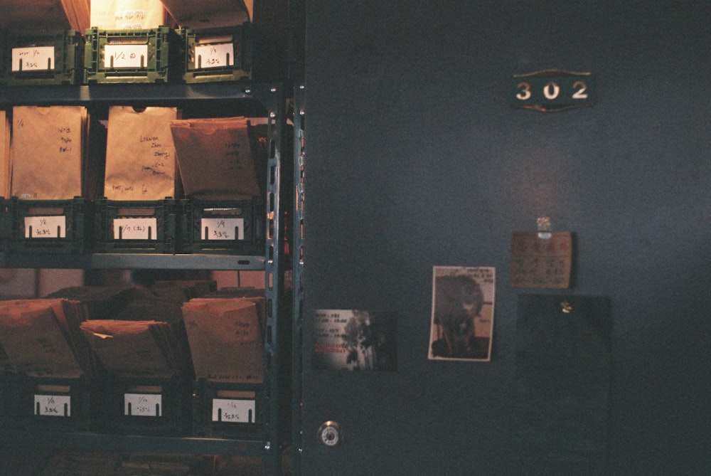 black wooden shelf with books