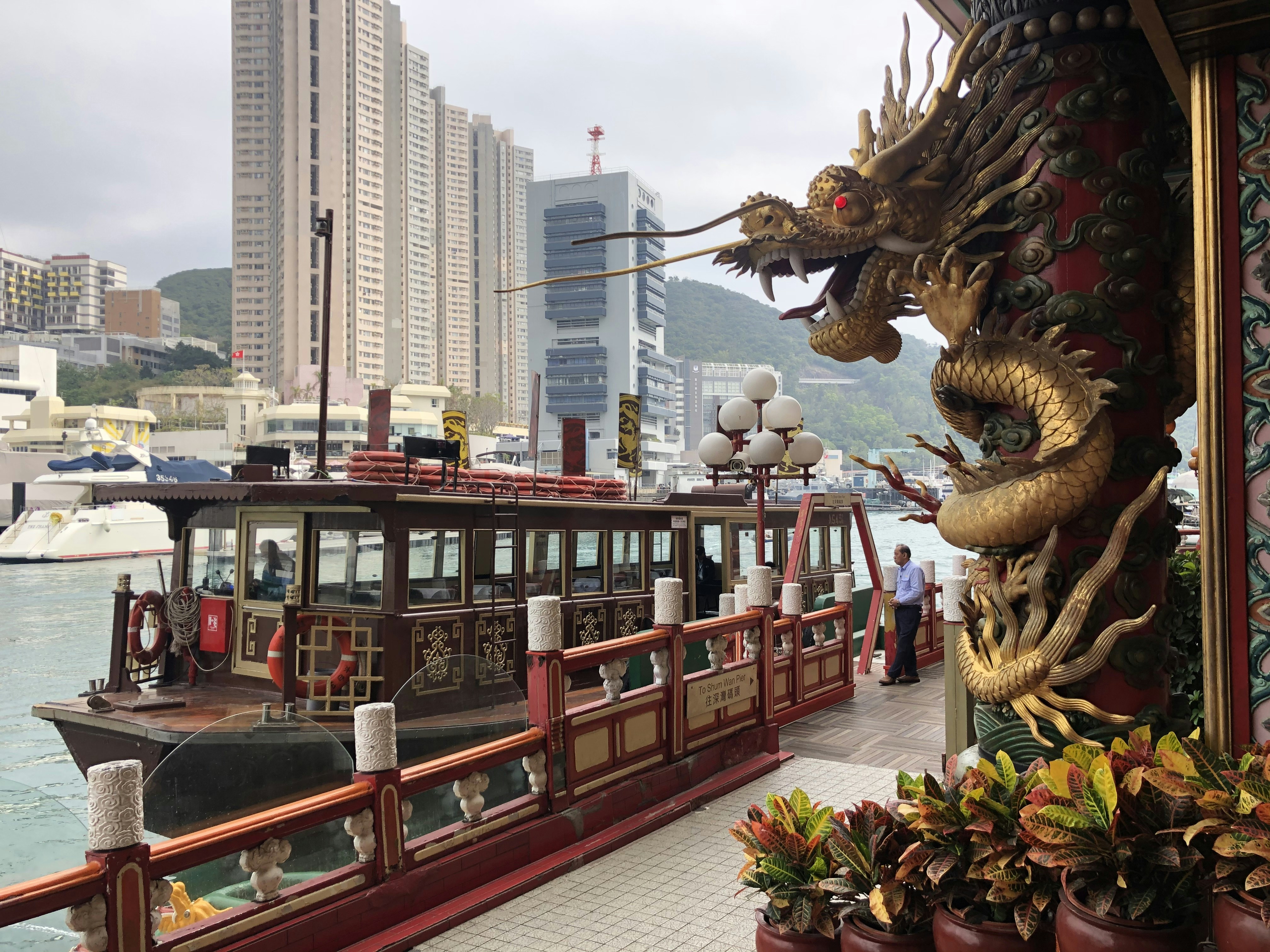 brown dragon statue near building during daytime