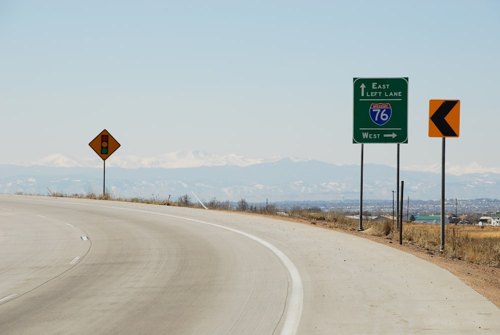 green and white road sign