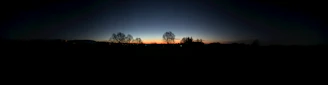 A panoramic view of the sunset crowd thinning, revealing the peaceful beauty beneath