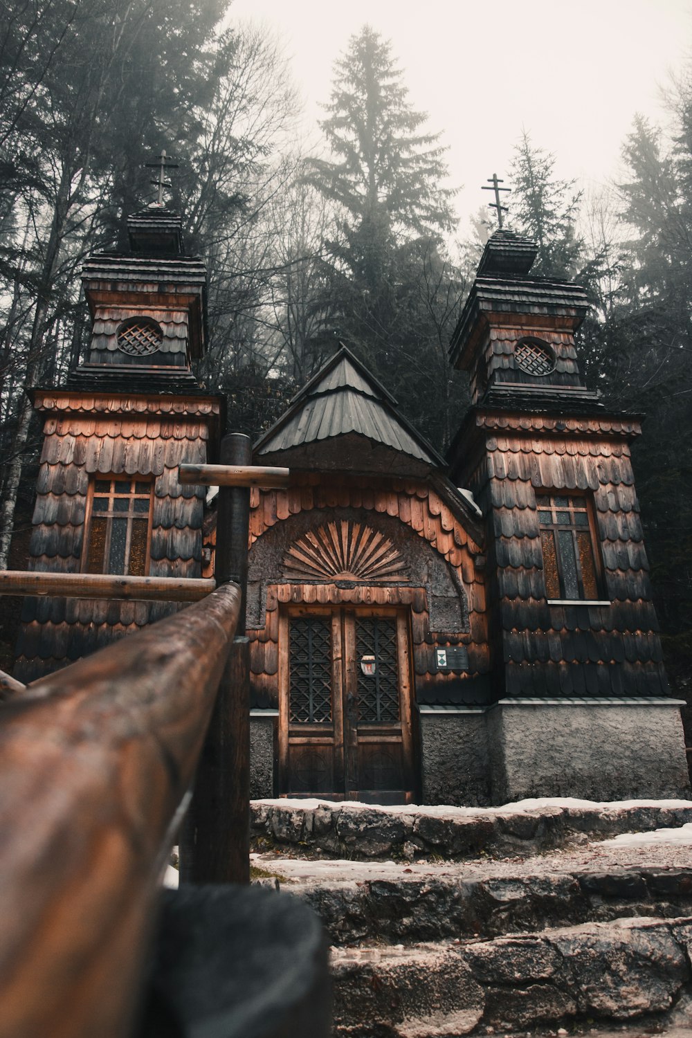 brown wooden house near trees during daytime