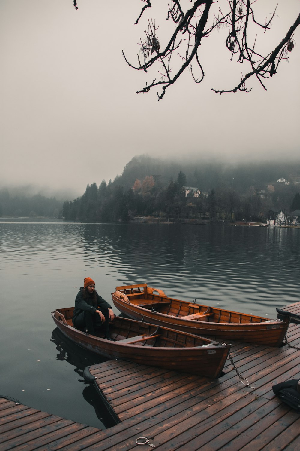 people riding on brown boat on lake during daytime