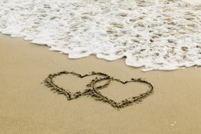 white sand with heart shaped sand