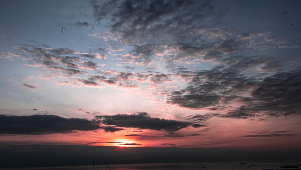 silhouette of clouds during sunset