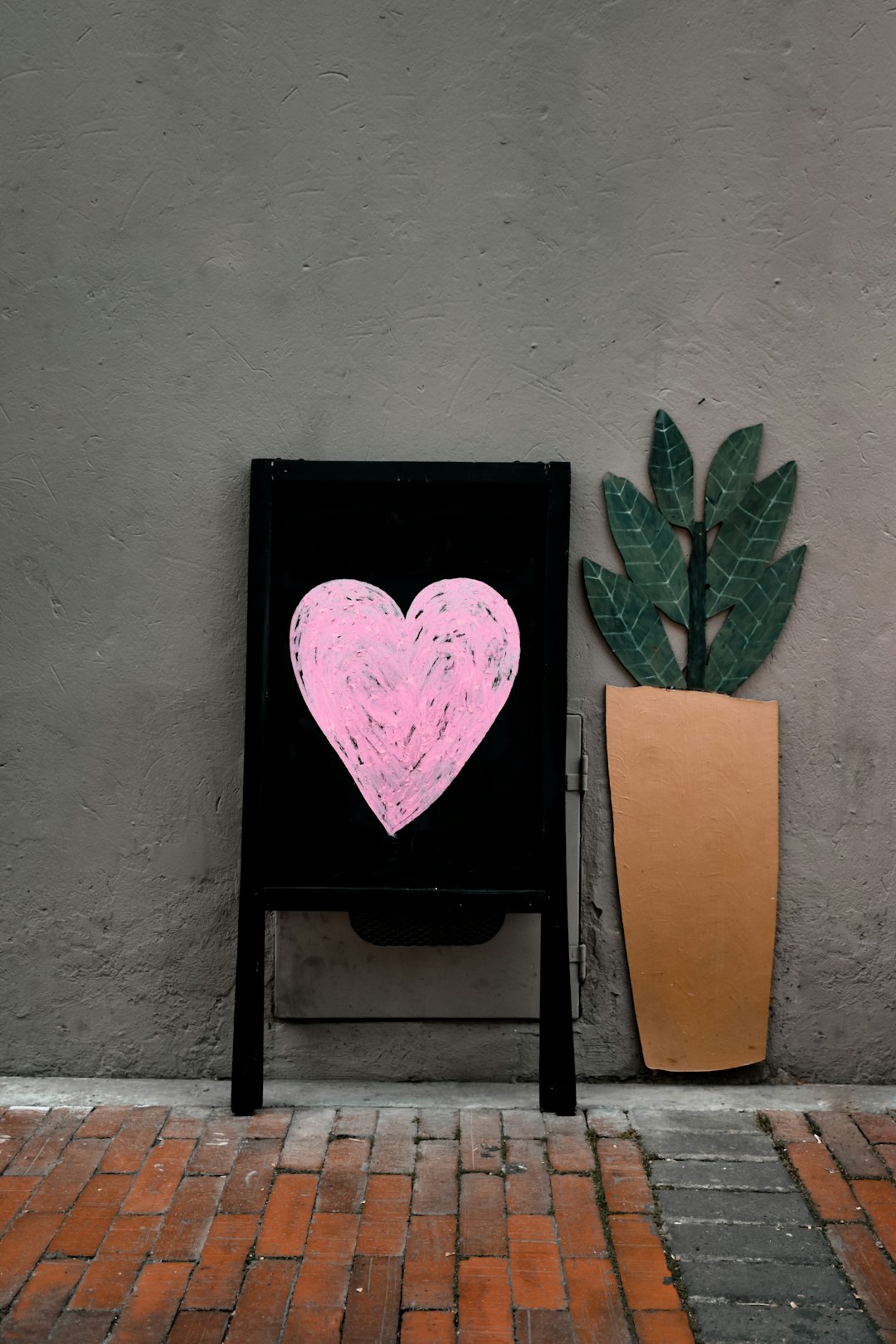 brown wooden door with green plant