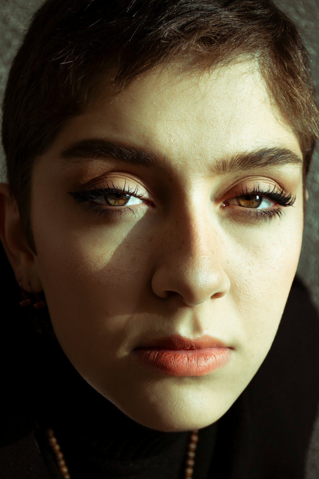 womans face with red lipstick