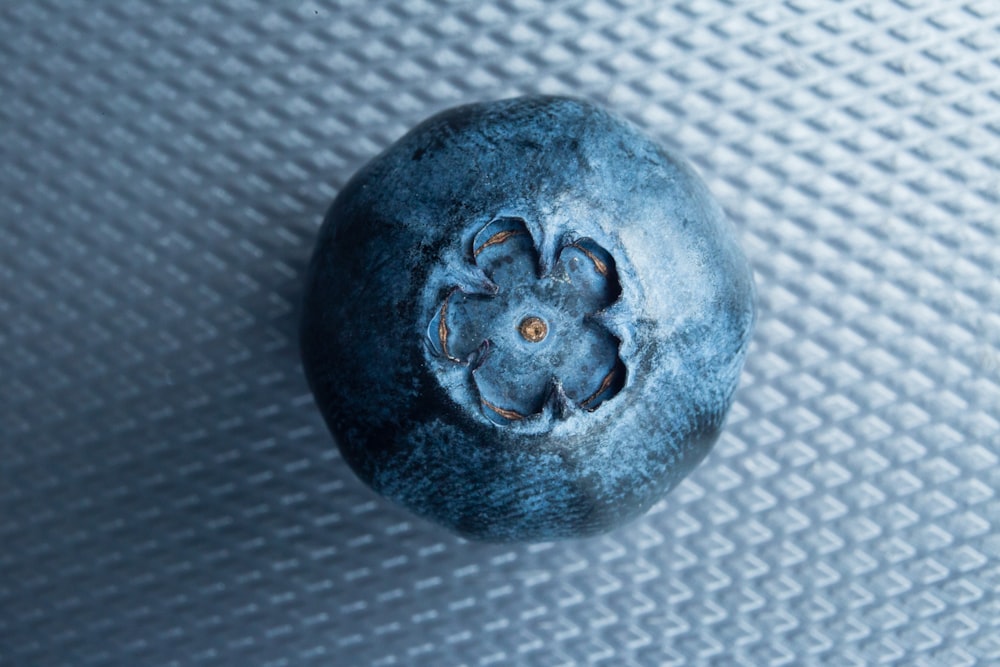 brown round ornament on brown textile