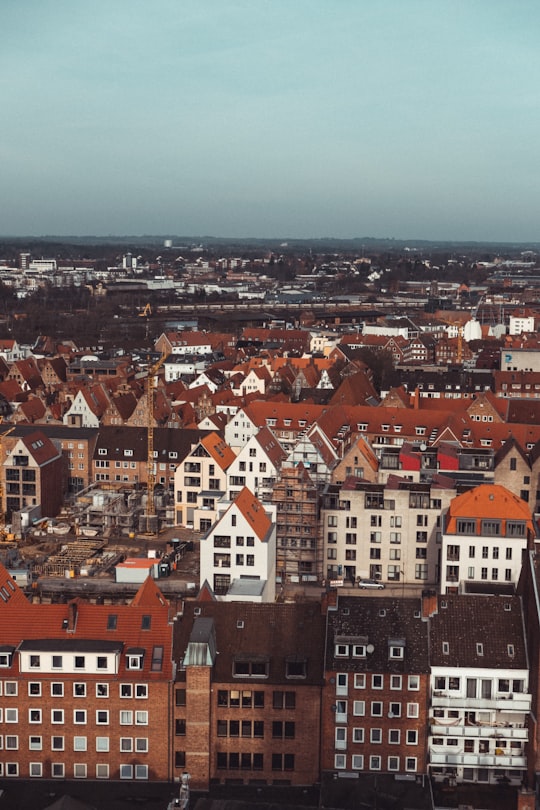 brown and white concrete houses during daytime in Lübeck Germany