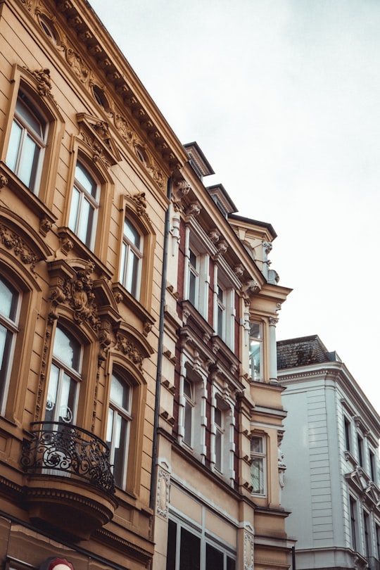 brown concrete building during daytime in Lübeck Germany