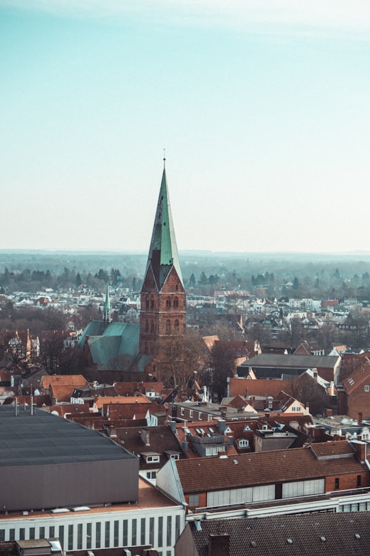 brown and green concrete building in Lübeck Germany