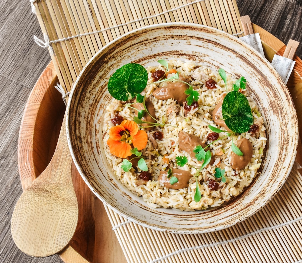 brown wooden bowl with food