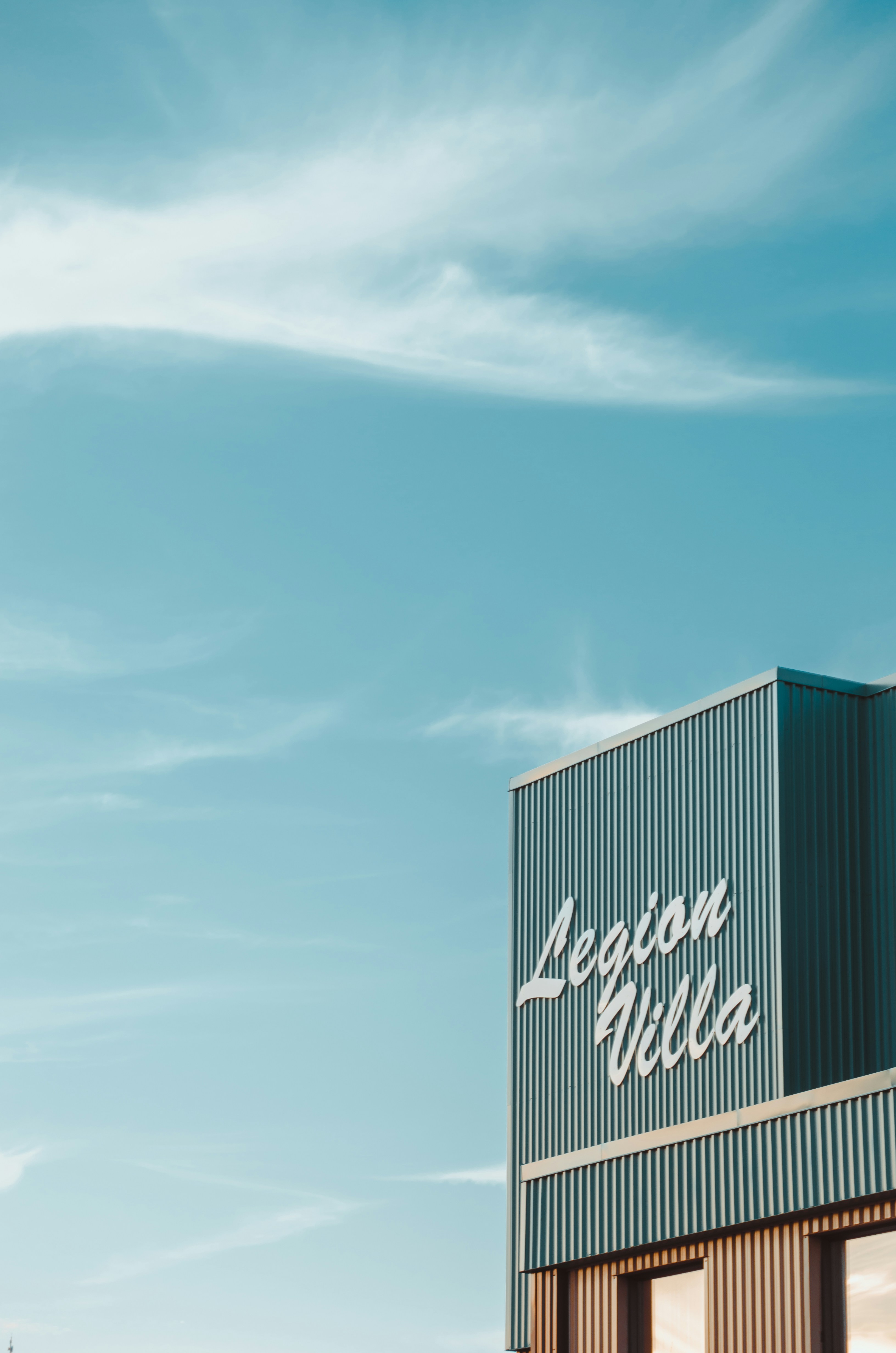 black and white concrete building under blue sky during daytime