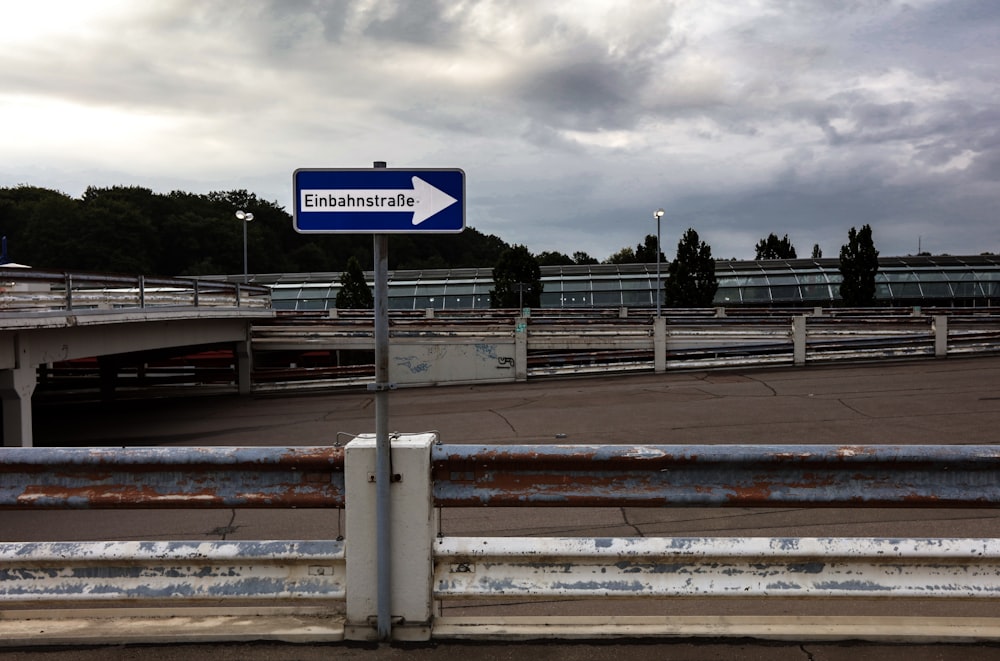 blue and white street sign