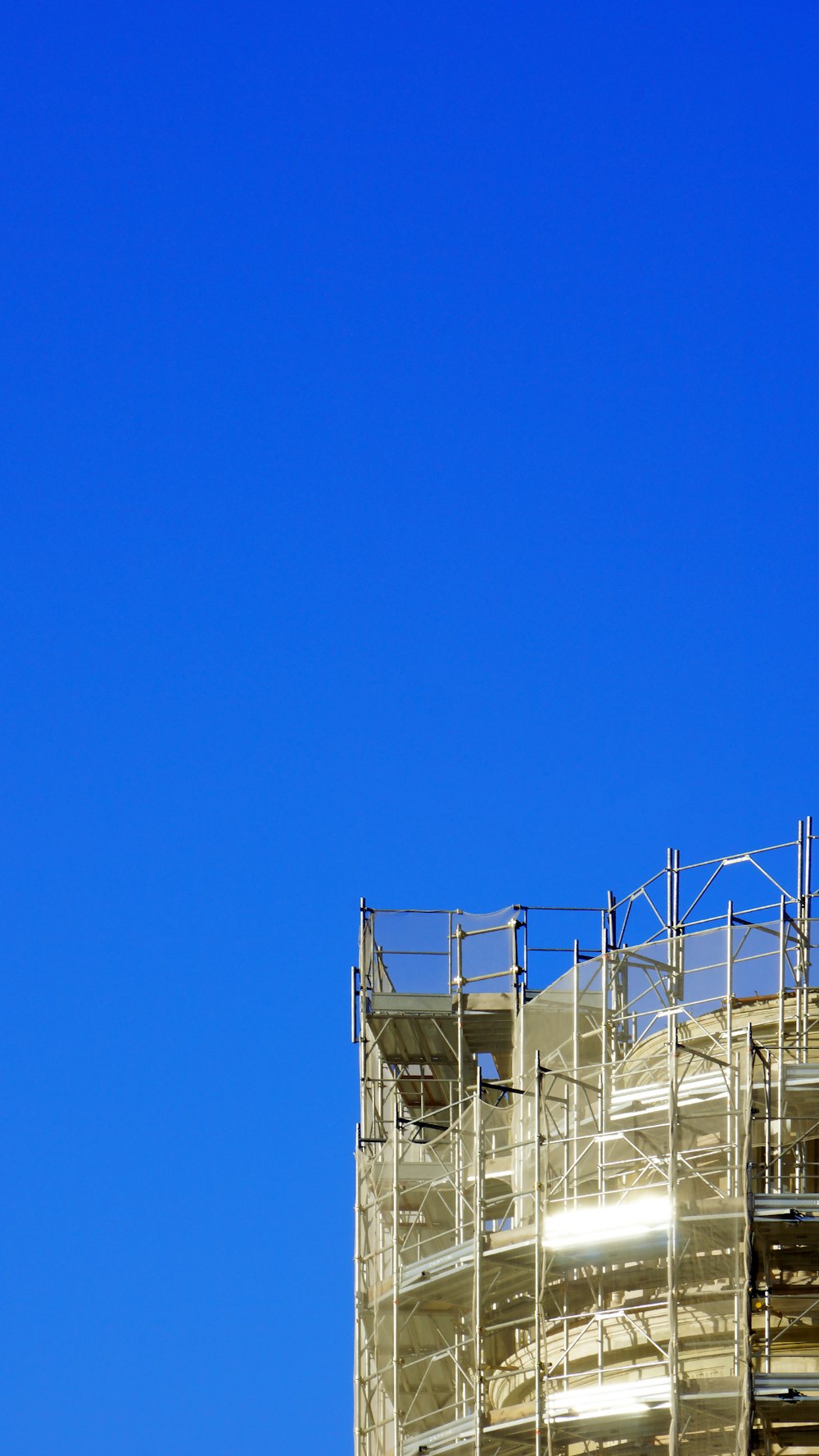 white metal frame under blue sky during daytime