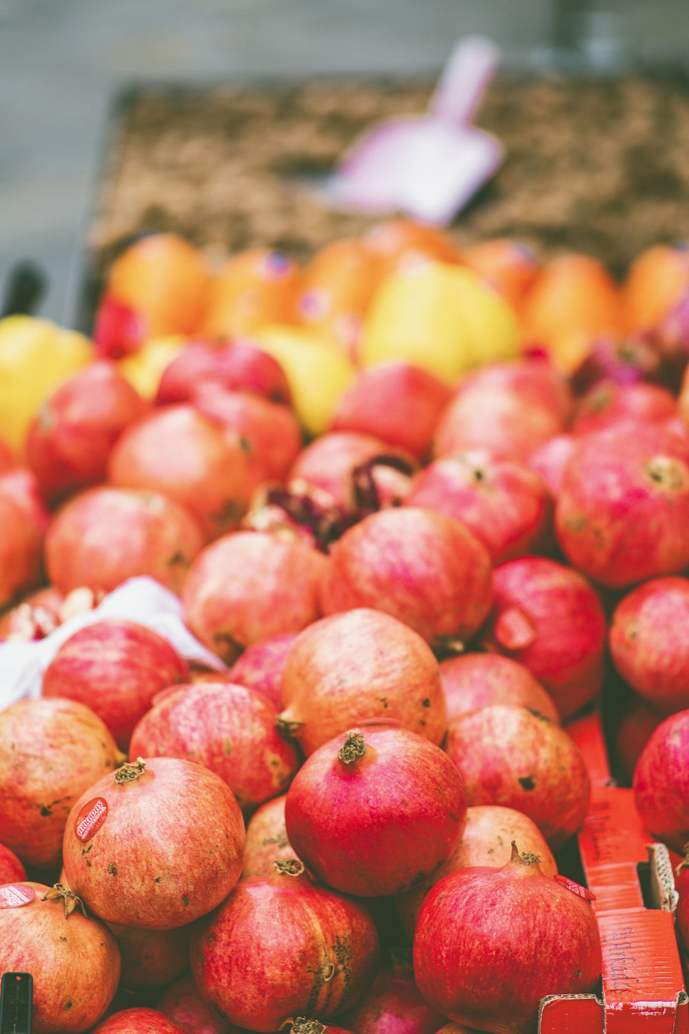 red apples on yellow plastic container