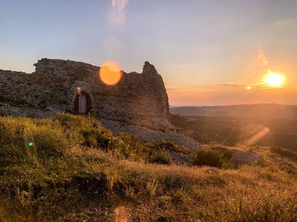 brown rock formation during sunset