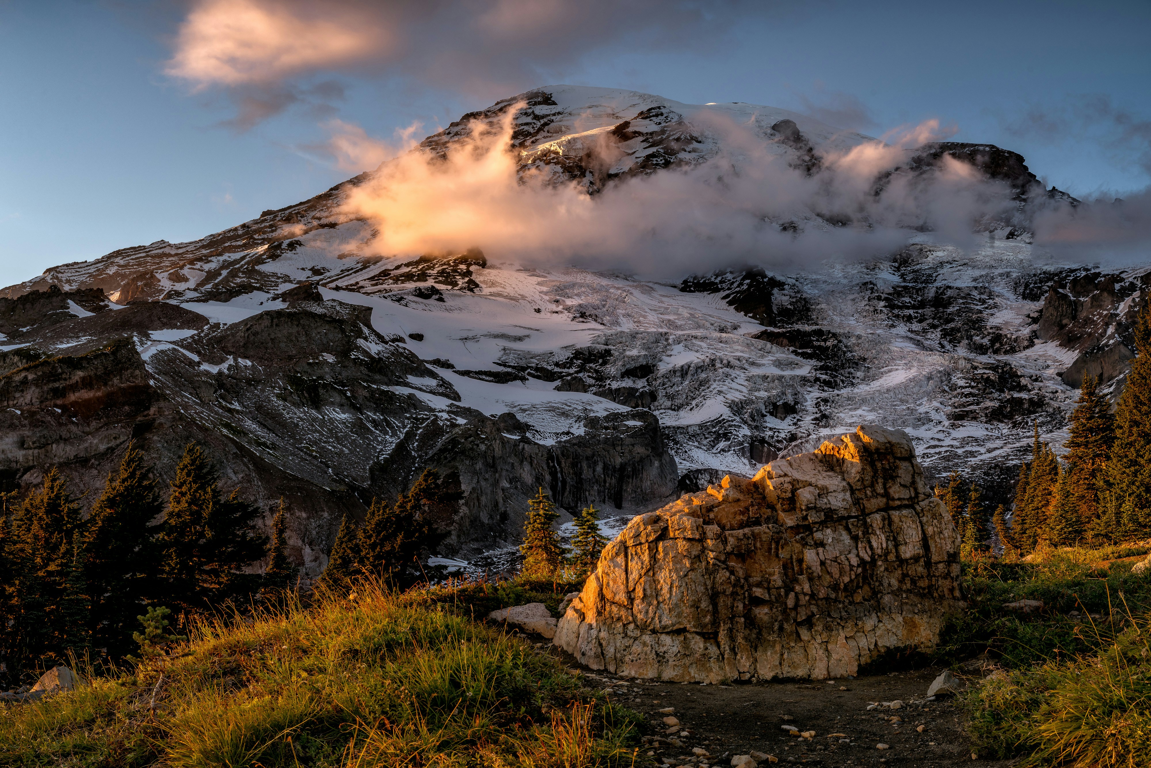 brown rocky mountain under cloudy sky during daytime