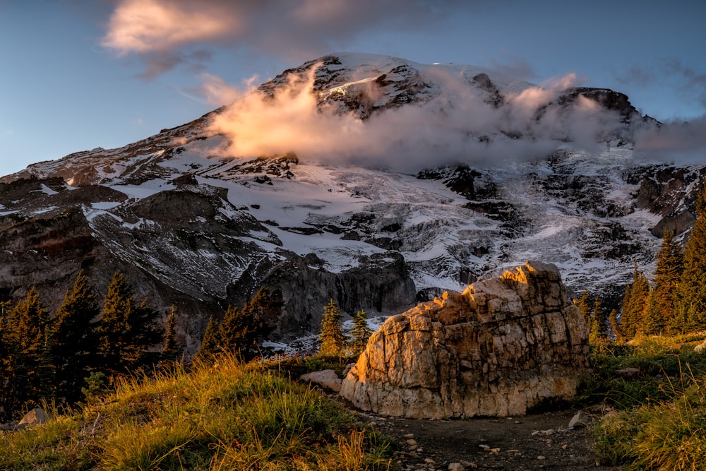 brown rocky mountain under cloudy sky during daytime