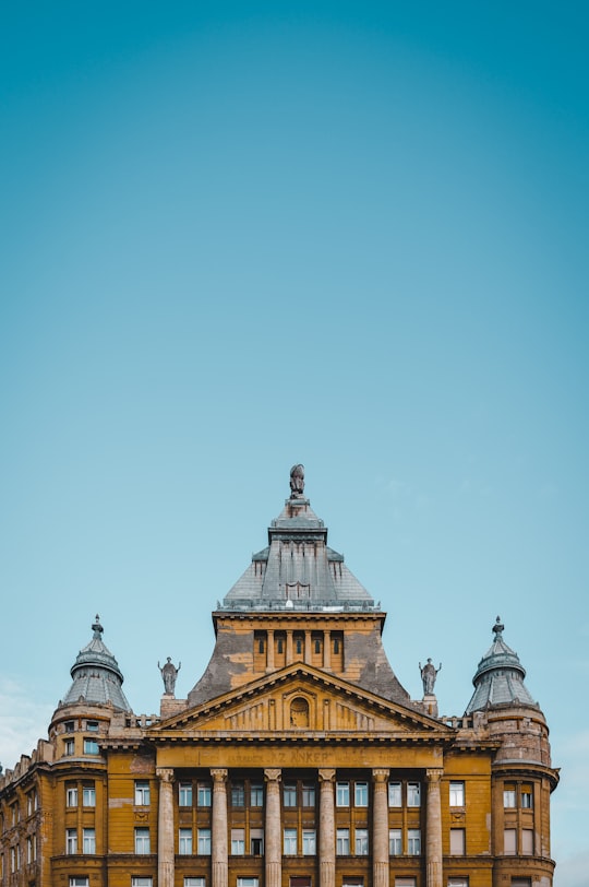 brown and white concrete building under blue sky during daytime in Erzsébet Square Hungary