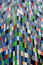 Colorful composite panel facade with geometric design patterns.
